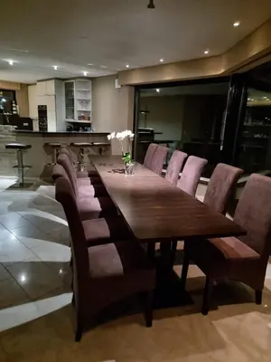 a dining room with a wooden table and chairs at Lakeview in Keerbergen