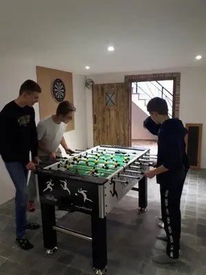 a group of people standing around a giant billiard table at Lakeview in Keerbergen