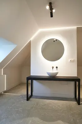 a bathroom with a sink and a mirror at Moleneinde 10 in Weelde