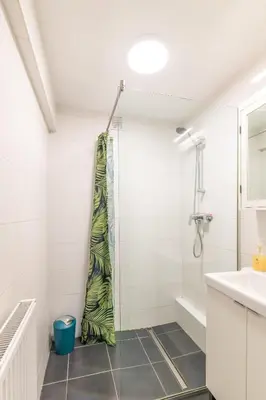 a bathroom with a shower and a sink at VilvoCity Center in Vilvoorde