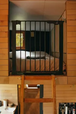 a bunk bed in a room with a bed in it at Tiny House Célestine By Ernesst in Overijse