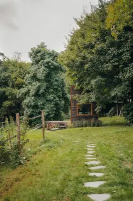 a small house in the middle of a field at Tiny House Célestine By Ernesst in Overijse