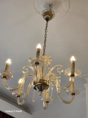 a chandelier is hanging from a ceiling at Brussels 1904 in Brussels
