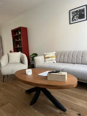 a living room with a coffee table and a couch at FDS Cosy House in Ghent