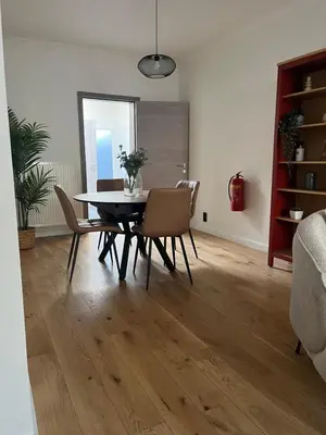 a dining room with a table and chairs at FDS Cosy House in Ghent