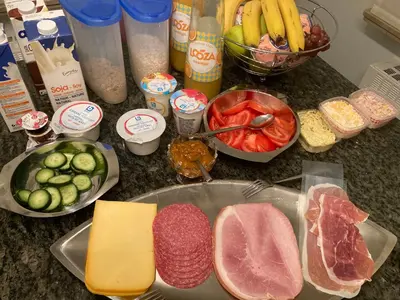 a counter top with meat and vegetables and other ingredients at Crea Els in Westerlo