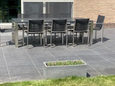 a table and chairs sitting on a patio at Crea Els in Westerlo