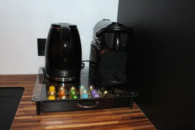 a coffeemaker sitting on a table next to a coffee maker at Maison Drappier in Ghent