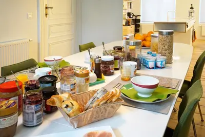 a table with a bunch of food on it at B&B Home & the City in Brussels
