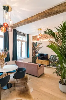 a living room with a couch and a table at Beautiful appartment in the heart of Antwerp in Antwerp