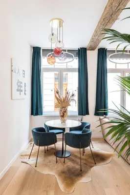 a dining room with a table and chairs at Beautiful appartment in the heart of Antwerp in Antwerp
