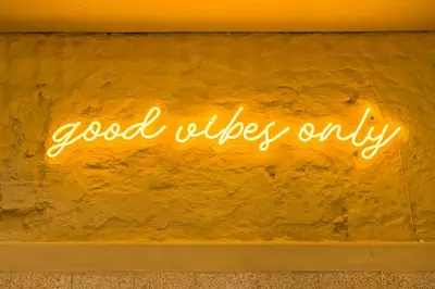 a neon sign that says good vibes only on a wall at Beautiful appartment in the heart of Antwerp in Antwerp