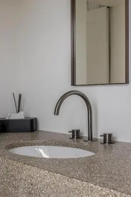 a bathroom counter with a sink and a mirror at Hotel Nenuphar in Ghent