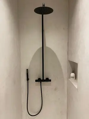 a black light hanging from a wall in a room at Casa Clementina - 3 Bedroom Apartment in a Art-Nouveau House in Ghent