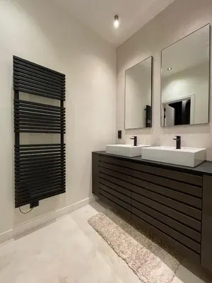 a bathroom with two sinks and a mirror at Casa Clementina - 3 Bedroom Apartment in a Art-Nouveau House in Ghent