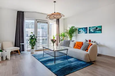 a living room with a couch and a table at Royal Design Residence in Brussels