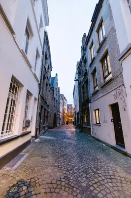 an empty street in the city of brasov at De Moriaan Antwerp Historic Center in Antwerp