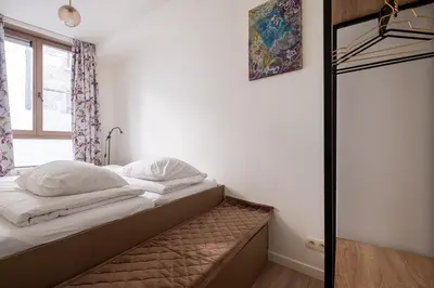 a small bed in a room with a window at De Moriaan Antwerp Historic Center in Antwerp