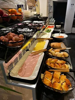 a buffet line with many different types of food at Hotel Aviation in Brussels