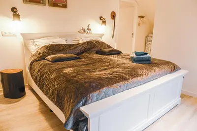 a bed with two pillows on it in a bedroom at D&A nest in Retie