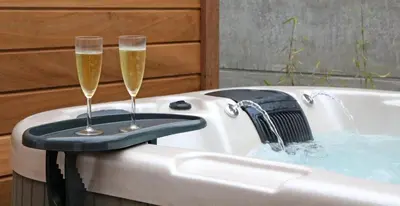 two champagne glasses sitting in a bath tub at Maison des Étoiles in Aalst