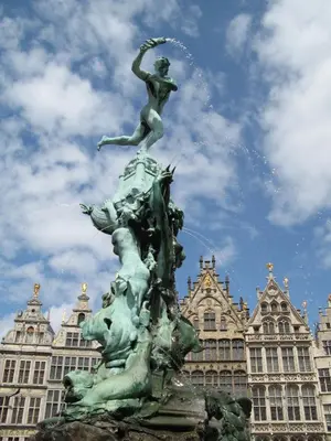 a statue of a woman on top of a fountain at Apartment View of Antwerp in Antwerp