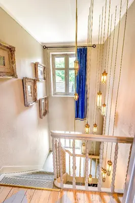 a staircase in a home with a blue curtain at Raesborre Homes - Self Check-in in Leuven