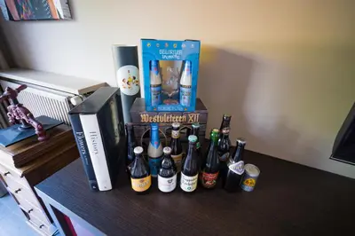 a group of bottles of beer on a table at Su'ro Bed and Breakfast in Ghent