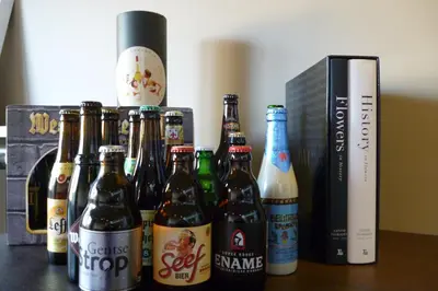 a group of bottles of beer sitting on a table at Su'ro Bed and Breakfast in Ghent