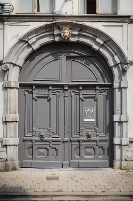 a large metal door on the side of a building at City Garden Ghent in Ghent