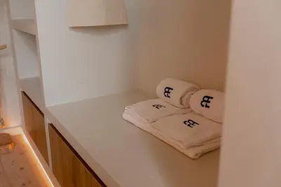 two towels sitting on a shelf in a kitchen at BTFL Living, Luxury Residences Antwerp, Zirkstraat in Antwerp
