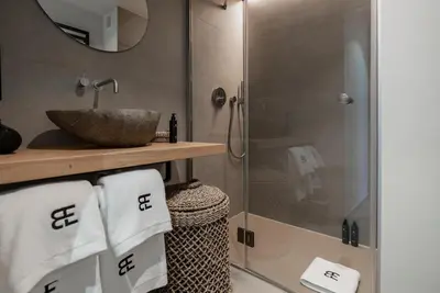 a bathroom with a glass shower and a sink at BTFL Living, Luxury Residences Antwerp, Zirkstraat in Antwerp
