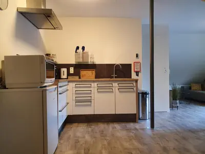 a kitchen with a sink and a microwave at De Gorzen in Oud-Turnhout