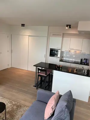 a living room with a couch and a kitchen at 