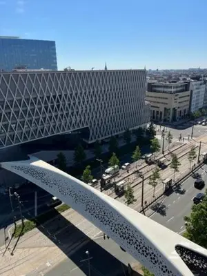 an overhead view of a city with a building at 