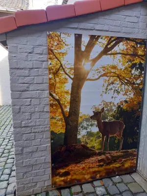 a painting of a deer on the side of a house at Natuurschoon Vakantiewoning Moorsel in Moorsel