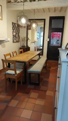 a dining room with a wooden table and chairs at Plezantwerpen, Zuiderzin in Antwerp