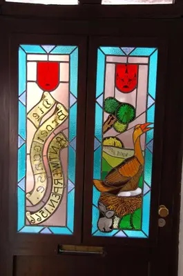 a door with two stained glass windows on it at Plezantwerpen, Zuiderzin in Antwerp