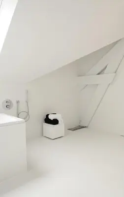 a white bathroom with a sink and a box at Maison Nationale City Flats & Suites in Antwerp