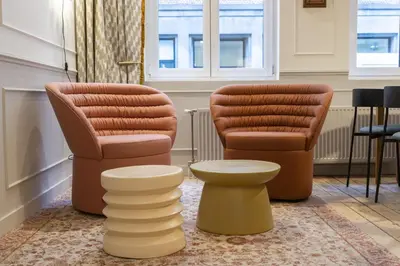 two chairs and a stool in a room at SHWAY - Le Lambermont in Antwerp