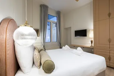 a hotel room with a bed and a television at SHWAY - Le Lambermont in Antwerp