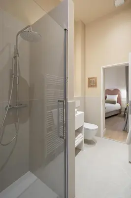 a bathroom with a shower and a toilet and a sink at SHWAY - Le Lambermont in Antwerp