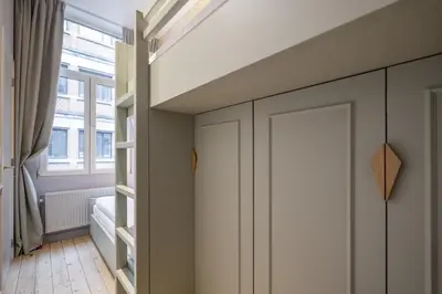 a room with a door and a window at SHWAY - Le Marnix in Antwerp