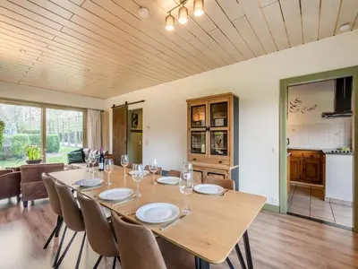 a large dining room with a table and chairs at Merksplas Villa with Terrace in Merksplas