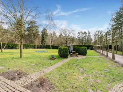 a garden with a picnic table and a frisbee at Merksplas Villa with Terrace in Merksplas