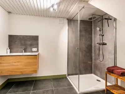 a bathroom with a shower and a sink at Merksplas Villa with Terrace in Merksplas