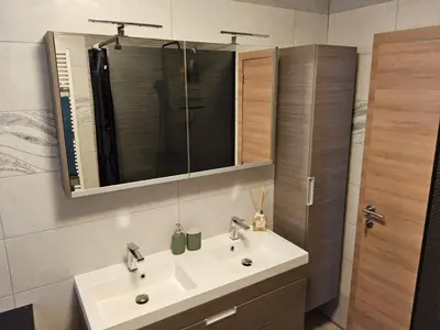 a bathroom with a sink and a mirror at Chambre deluxe au 2ème étage, chambre double au 4ème étage NOT A HÔTEL in Brussels
