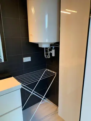 a kitchen with a sink and a coffee maker at Prachtige gastsuite in Ranst 