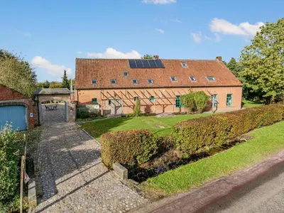 an estate with a house with a solar roof at Alverwege in Merksplas
