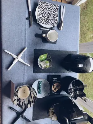 a group of dishes and utensils on a table at B&B Le 36 in Brussels